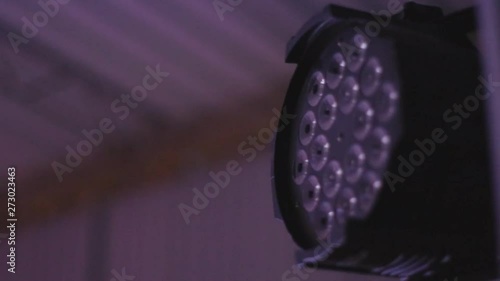 Nightclub LED spotlights glowing with different colored lights, moving in different directions..color lantern in a nightclub.Lighting device that changes color photo