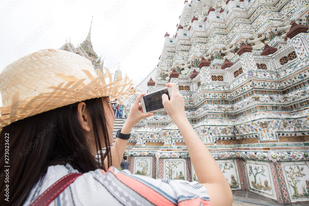 Beautiful asian tourist backpack women travel in buddhist temple sightseeing of Bangkok