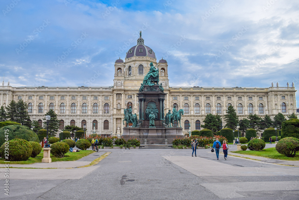 A lot of people are walking and relaxing near museum in center Vienna Austria at autumn