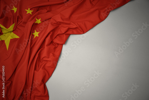 waving national flag of china on a gray background. photo