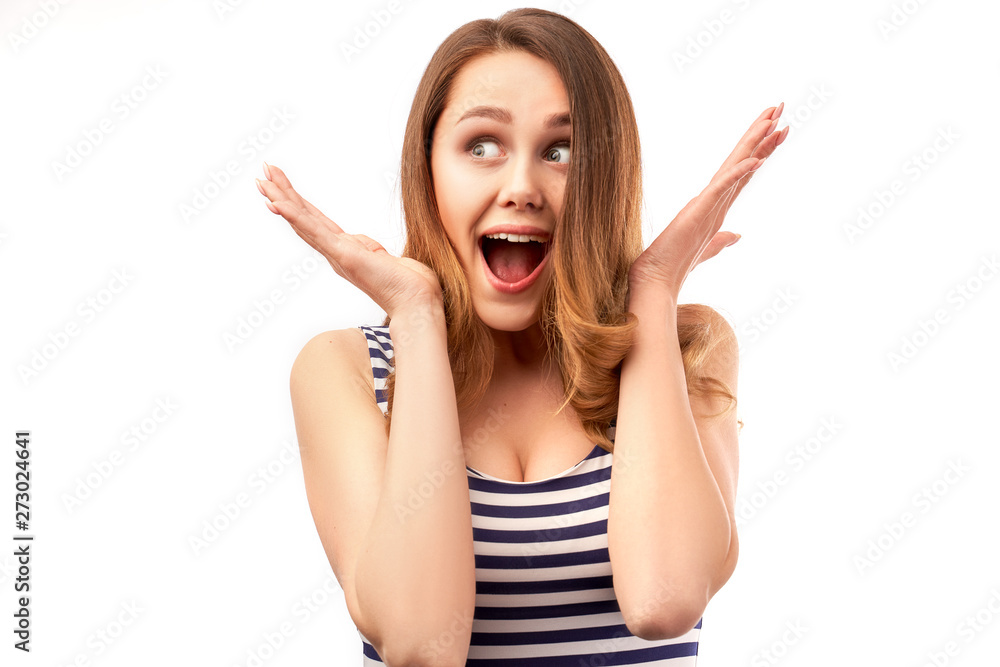 Portrait of cheerful Caucasian woman keeps both hands close to her face, looks to right and up. Human emotions and facial expressions concept Portrait of cheerful Caucasian woman keeps both hands close to her face, looks to right and up. Human emotions and facial expressions concept