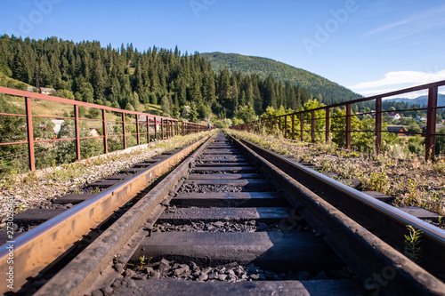 Rail tracks in the mountains. Railway among beautiful landscape.
