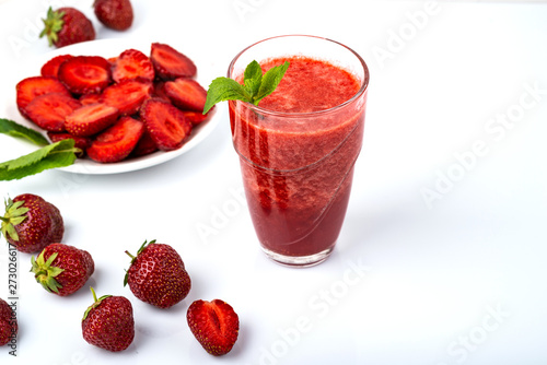 Tasty strawberry smoothie on white background. Fresh strawberry smoothie, summer drink, healthy antioxidant juice with vitamin from ripe fruits.