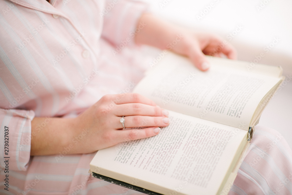 woman reading a book close up woman reading a book close up