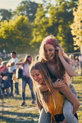 Portrait of happy young girls on holi color festival