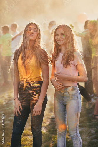 Portrait of happy young girls on holi color festival © Przemek Klos