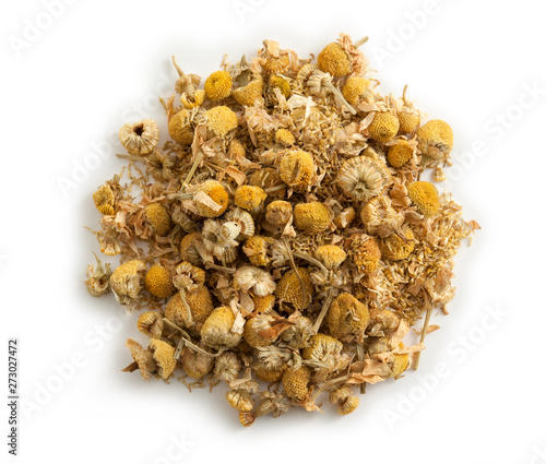 small pile of chamomile with honey, white background, close up