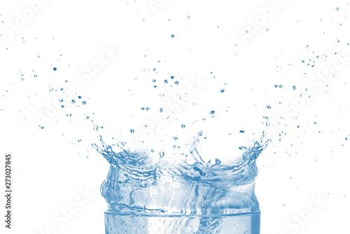 Top of transparent glass and blue water splash isolated on white background.