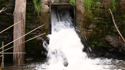 River waterfalls near a tree