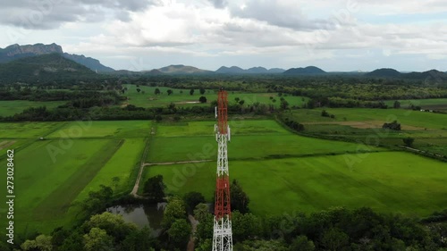 communications tower on the green field , asia , 5G , aerial view