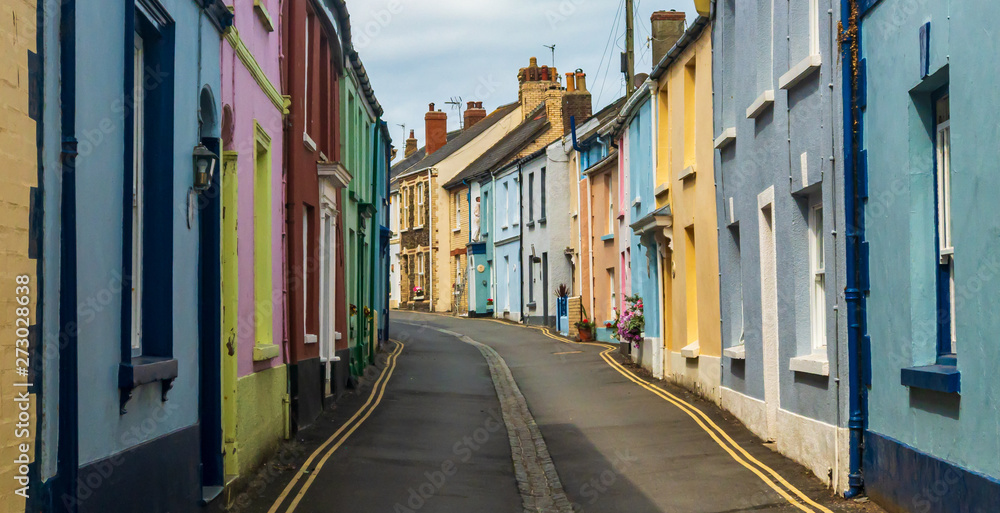 Brightly coloured terraced houses in Appledore street England Brightly coloured terraced houses in Appledore street England