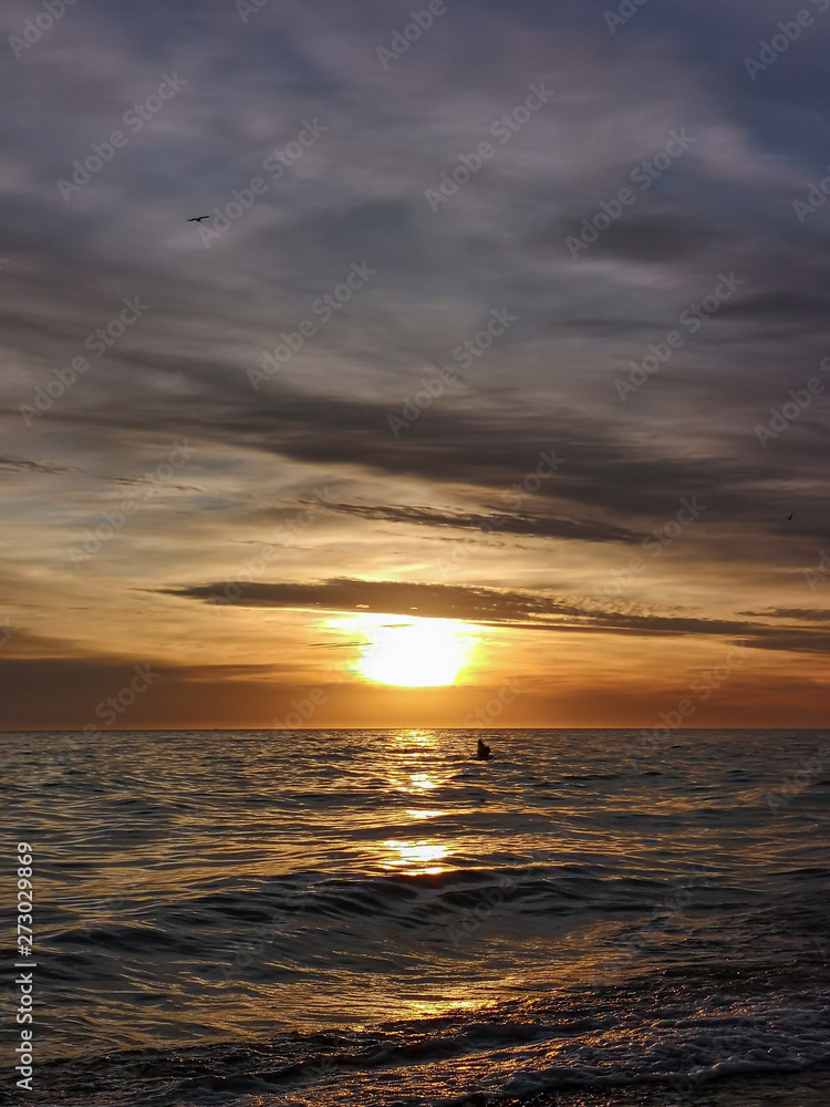 a dazzling dawn crossing the sea