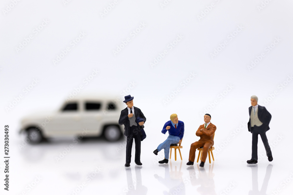 miniature people: Business consultants on financial transactions for car loan . Image use for financial, business concept.