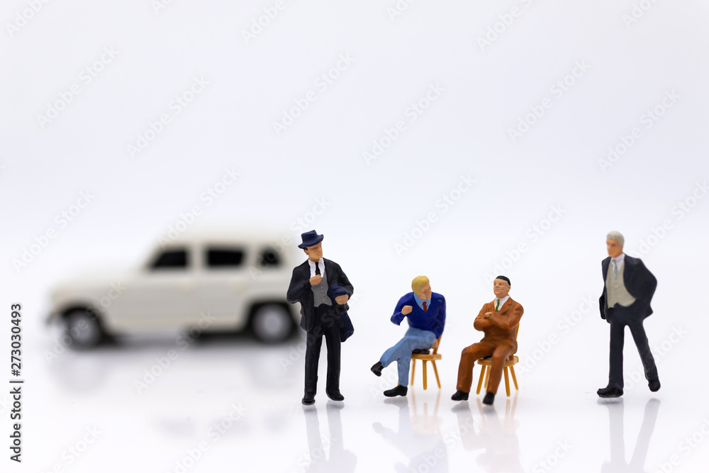 miniature people: Business consultants on financial transactions for car loan . Image use for financial, business concept. miniature people: Business consultants on financial transactions for car loan . Image use for financial, business concept.