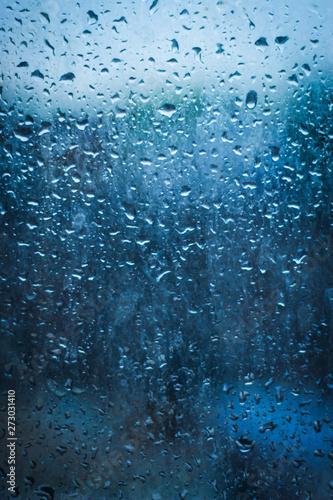 rain water drops on window glass, India in monsoon 
