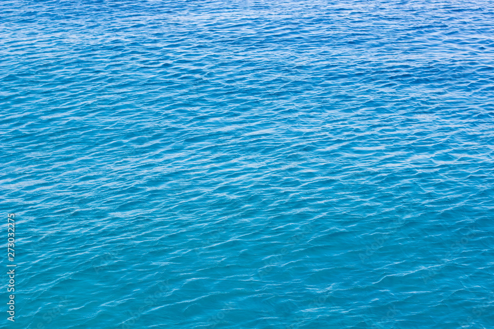 blue water aerial smooth background surface with small waves 