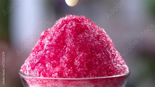 pouring Condensed milk into shaved ice, Slow motion shot