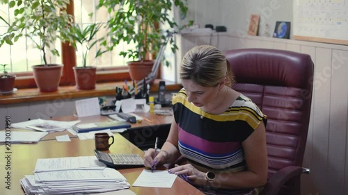 The girl in the office crumples the document