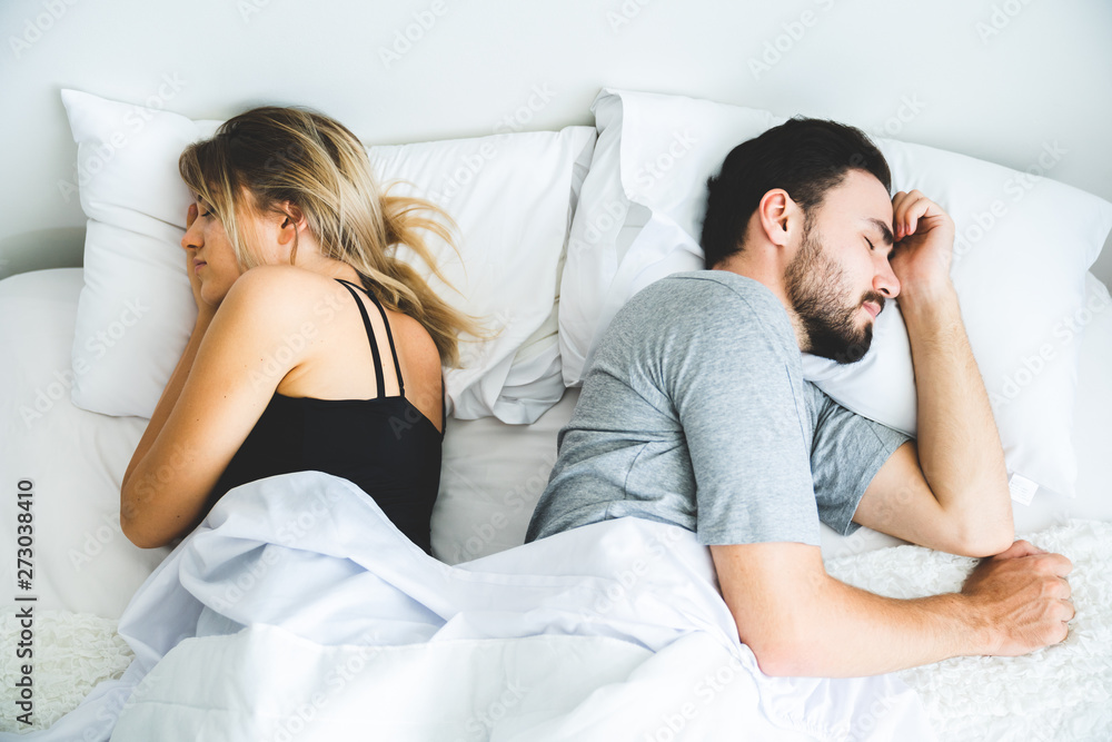 Sad lovers after quarrel ignoring avoiding sex in bed, frustrated man and woman not talking feeling offended or stubborn, unhappy married couple and sexual problems concept. Sad lovers after quarrel ignoring avoiding sex in bed, frustrated man and woman not talking feeling offended or stubborn, unhappy married couple and sexual problems concept.