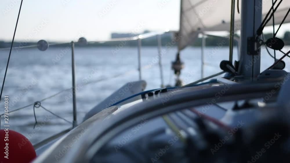 White private yacht or boat sailing in pond in summer White private yacht or boat sailing in pond in summer