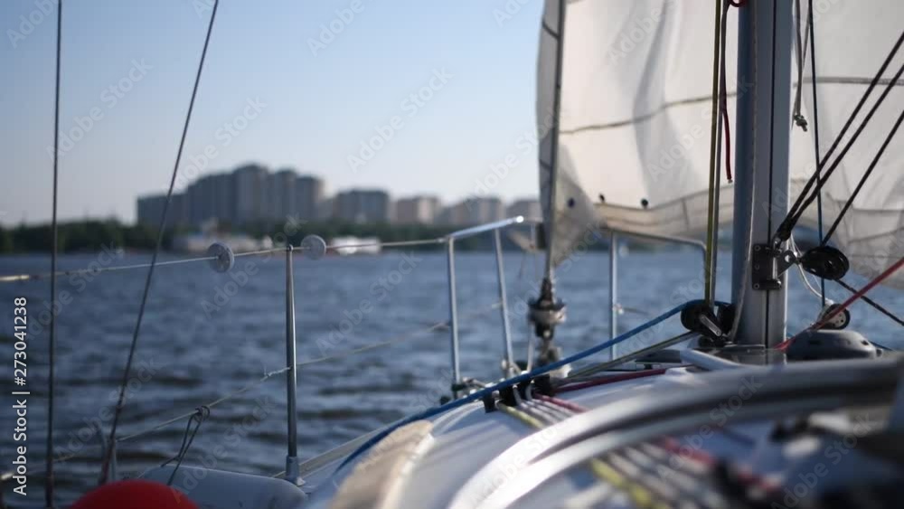 White private yacht or boat sailing in pond in summer White private yacht or boat sailing in pond in summer