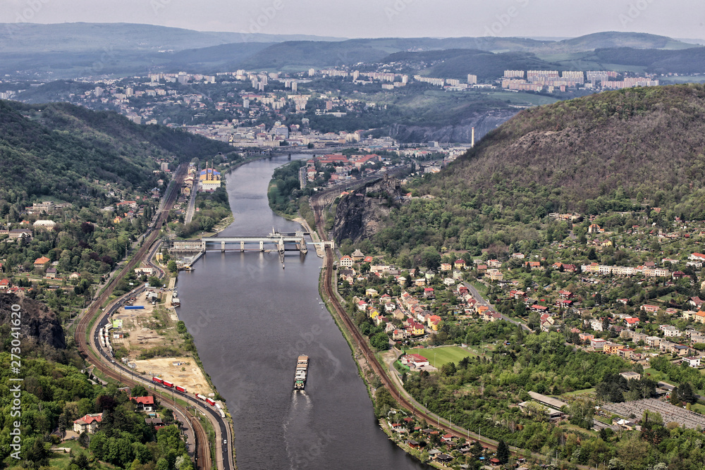 Labe river with the cargo boat by flood-gate of Usti-nad-Labem city