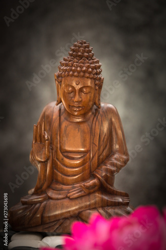 a view of a wood buddha statue