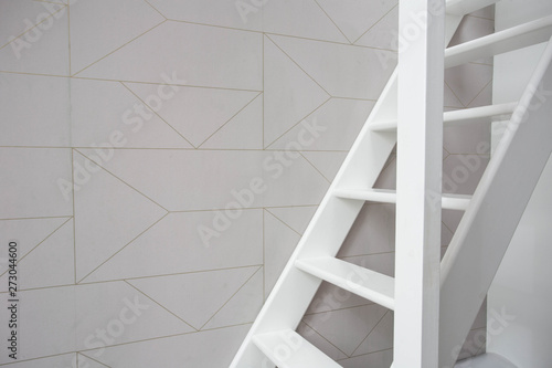 Stairs in modern white room  white wooden stairs with white wall retro wallpaper