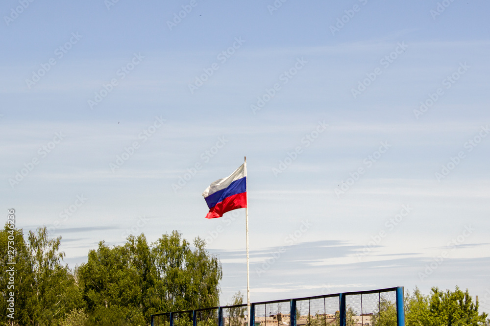 flag of the Russian Federation on a flagpole against the sky