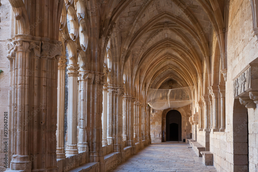 Arched gallery in the monastery of Santa Maria de Santes Creus (Aiguamurcia). Catalonia, Spain