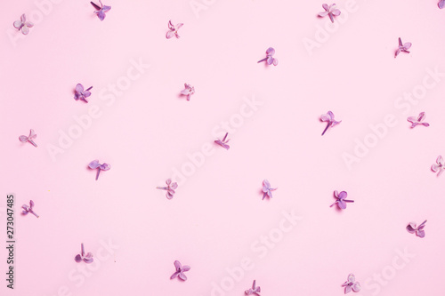 Lilac blossom flowers pattern in pink colors. Minimal creative background. top view, flat lay.