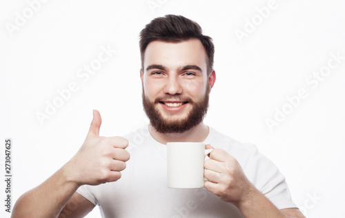 Good morning, man holding a cup tea. Morning concept.  © Raisa Kanareva