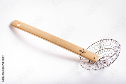 isolated japanese spider style strainer for ramen
