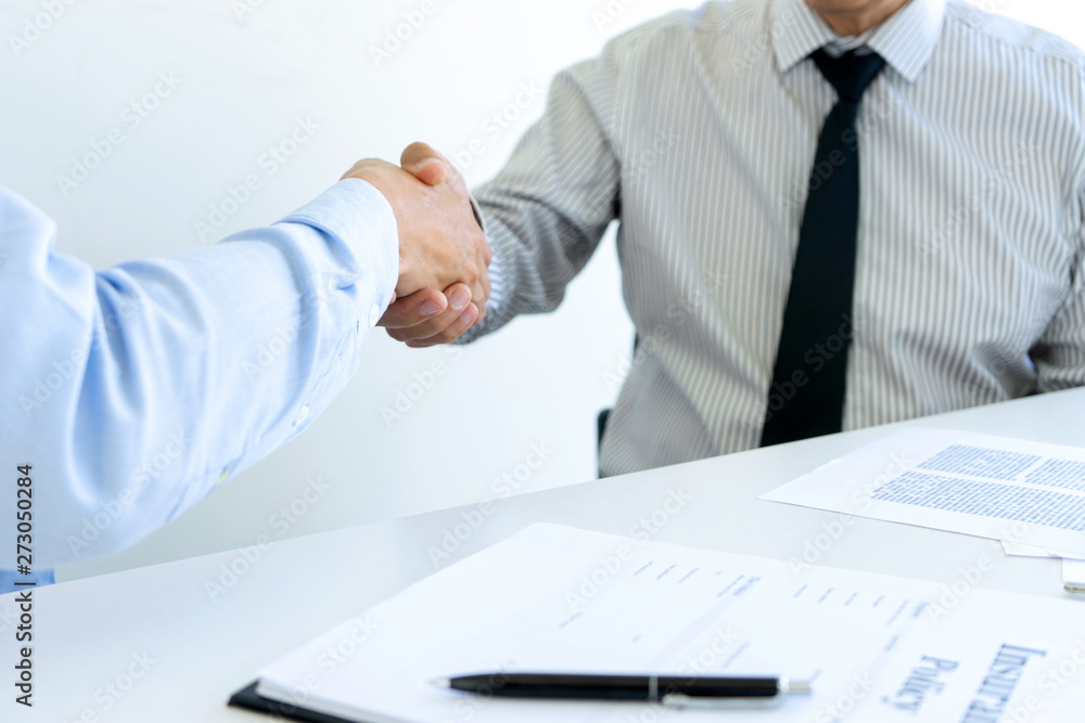 handshake of Real estate agent and customers in meeting handshake of Real estate agent and customers in meeting