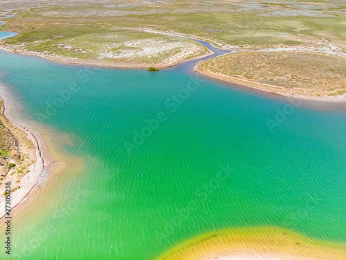 Amazing aerial view of bright green water lake in Bogdo-Baskunchak photo