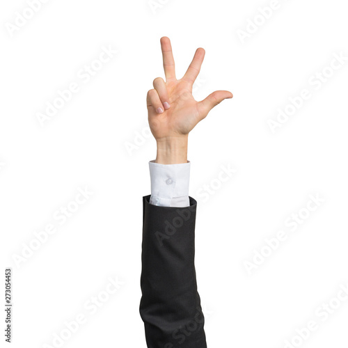 Businessman hand in suit showing rock gesture