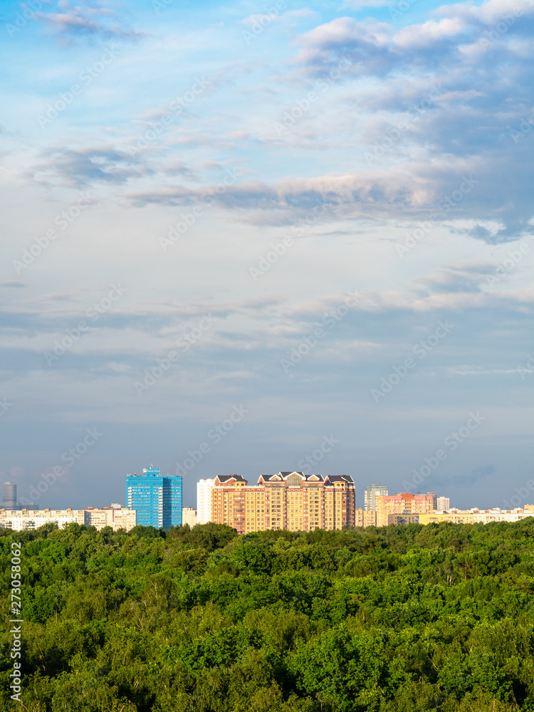 evenig sky over city park and residential houses evenig sky over city park and residential houses