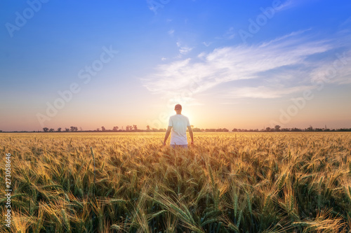 photographer while working search for a story / evening landscape man on the field