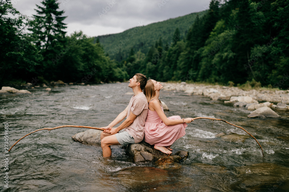 Fototapeta premium Funny couple fishing in the river.