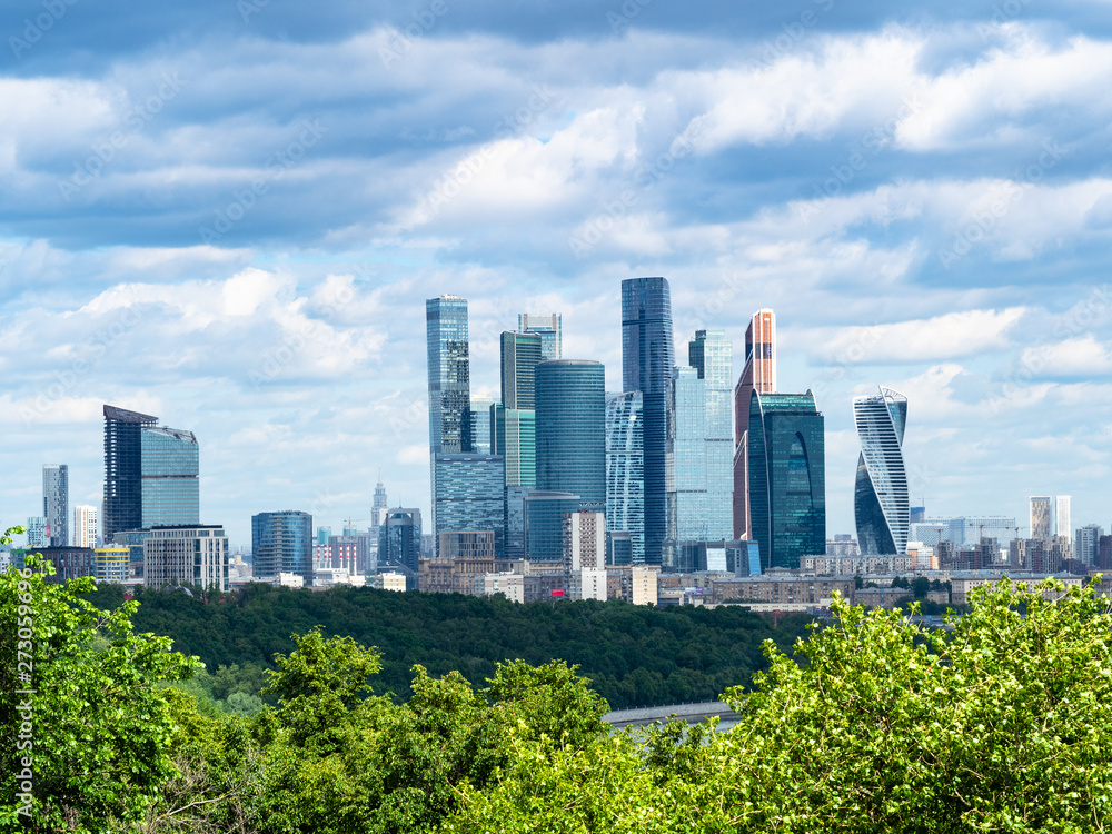Fototapeta premium skyscrapers of Moscow-city under dark blue clouds