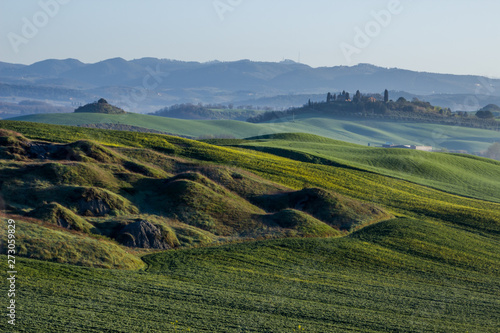 sunrise and fog over the hills in Tuscany