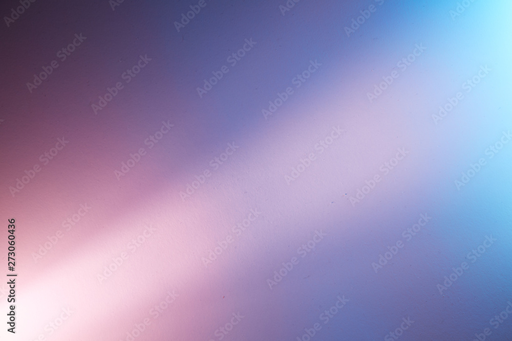 Scattered intermittent light pink beam of light on a blue background