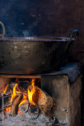 Traditional Brazilian food being prepared on old and popular wood stove