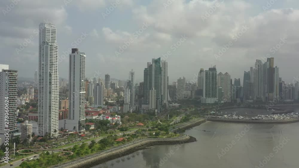 Scenic aerial view of downtown of capital of Panama. Beautiful cloudy look of skyscrapers on coastline of Pacific ocean in Panama-City. Shot of hightech megapolis in small country in Caribbean sea Scenic aerial view of downtown of capital of Panama. Beautiful cloudy look of skyscrapers on coastline of Pacific ocean in Panama-City. Shot of hightech megapolis in small country in Caribbean sea