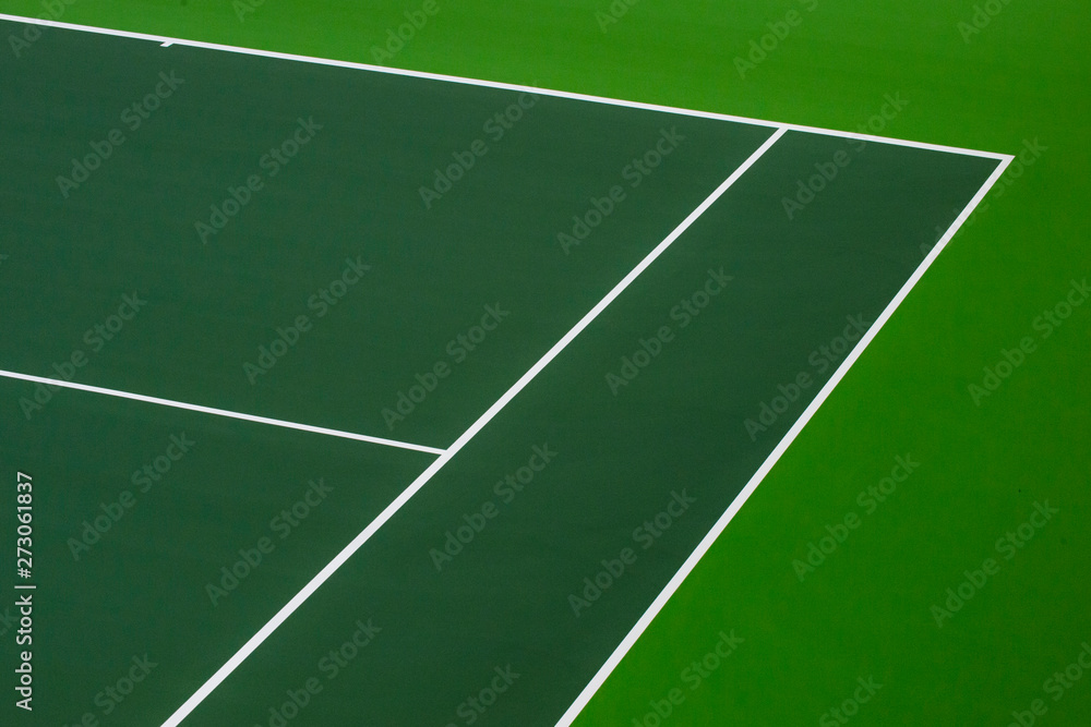 White lines of tennis courts on green floor background and have copy space for design backdrop in your work