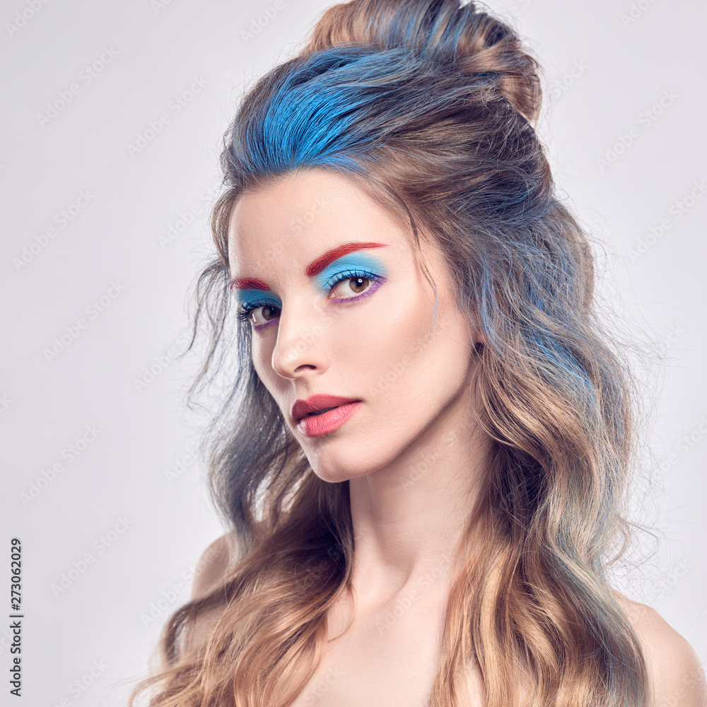 High Fashion. Beautiful woman with art paint makeup, creative Dyed hairstyle.  Gorgeous blonde girl with styling wavy hair, healthy skin. Young model girl,  fashionable make up. Creative Beauty portrait Stock Photo |