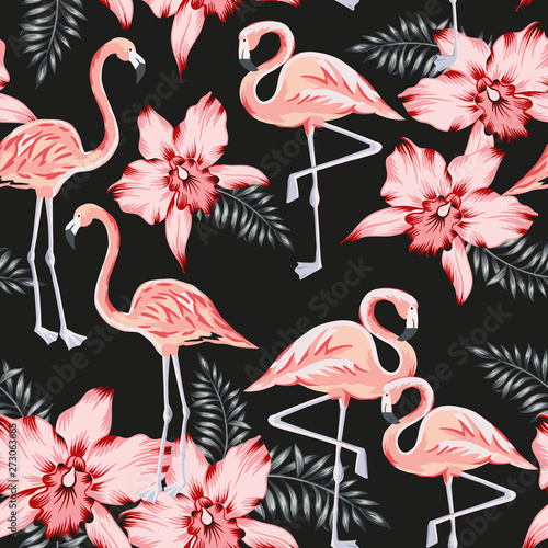Tropical pink flamingo, orchid flowers, palm leaves, black background. Vector seamless pattern. Jungle illustration. Exotic plants, birds. Summer floral design. Paradise nature