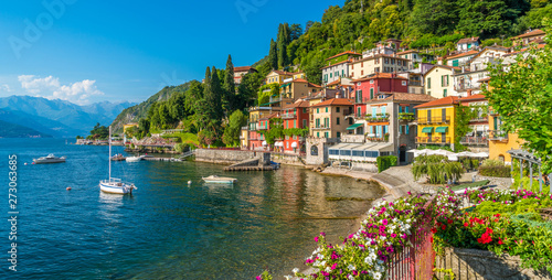 Beautiful Varenna waterfront on a sunny summer afternoon, Lake Como, Lombardy, Italy.