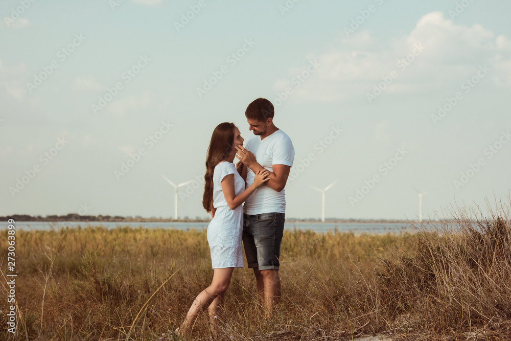 couple in a field at the seaside