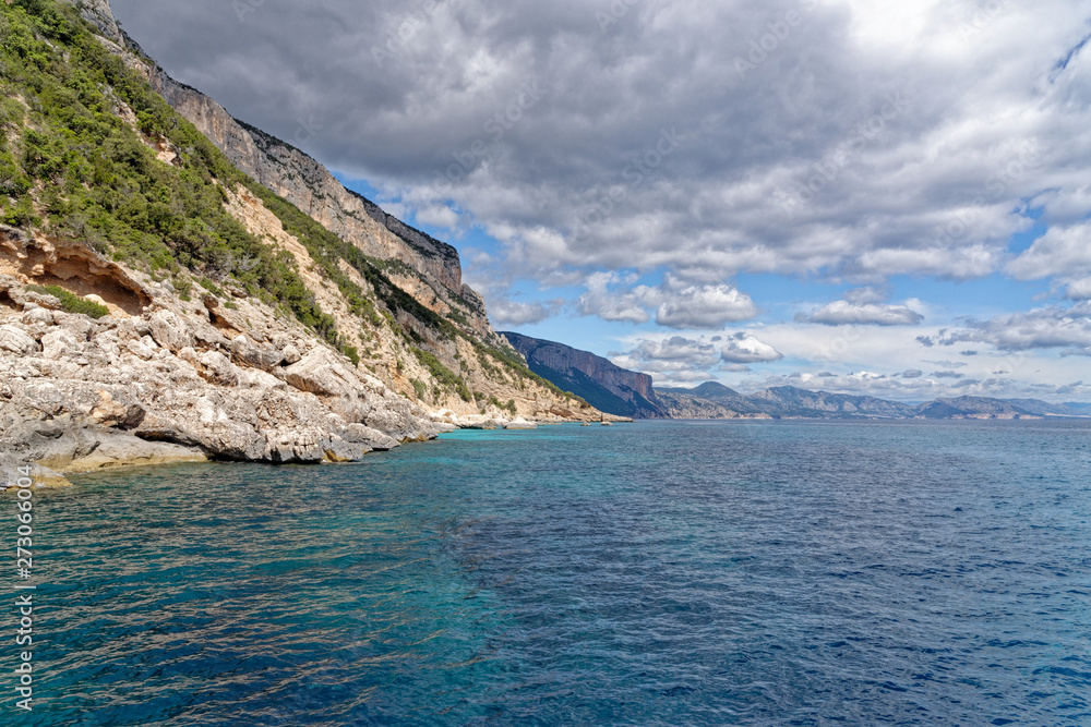 Sailboat off the coast of Sardinia - Italy Sailboat off the coast of Sardinia - Italy